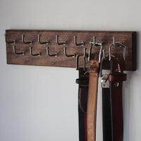 Wall mounted belt outlet hanger